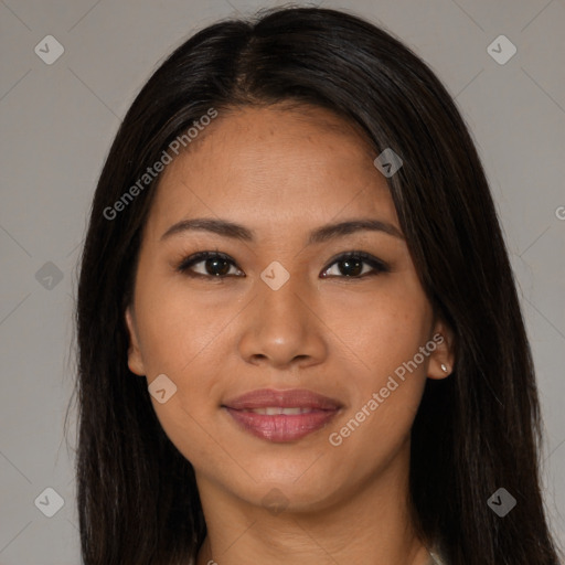 Joyful latino young-adult female with long  brown hair and brown eyes