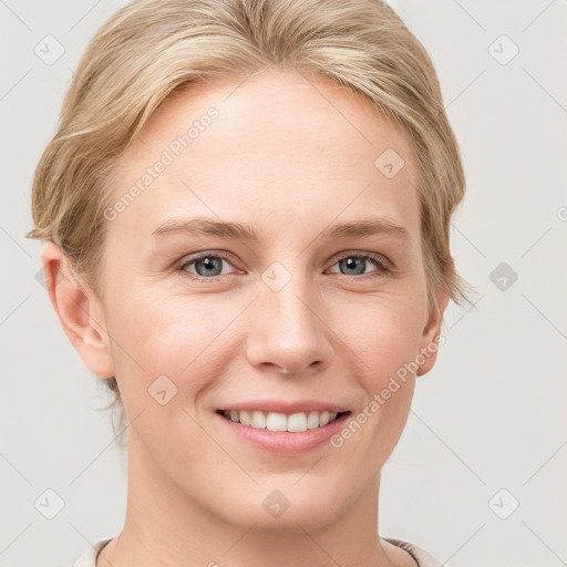 Joyful white young-adult female with medium  brown hair and blue eyes