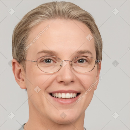 Joyful white adult female with short  brown hair and grey eyes