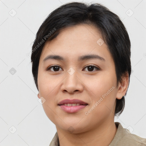 Joyful asian young-adult female with short  black hair and brown eyes