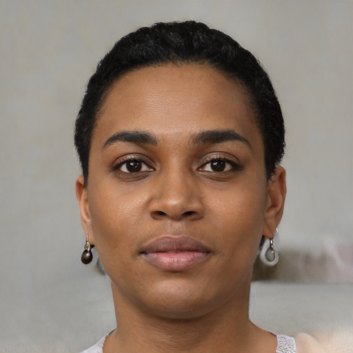 Neutral latino young-adult female with short  black hair and brown eyes
