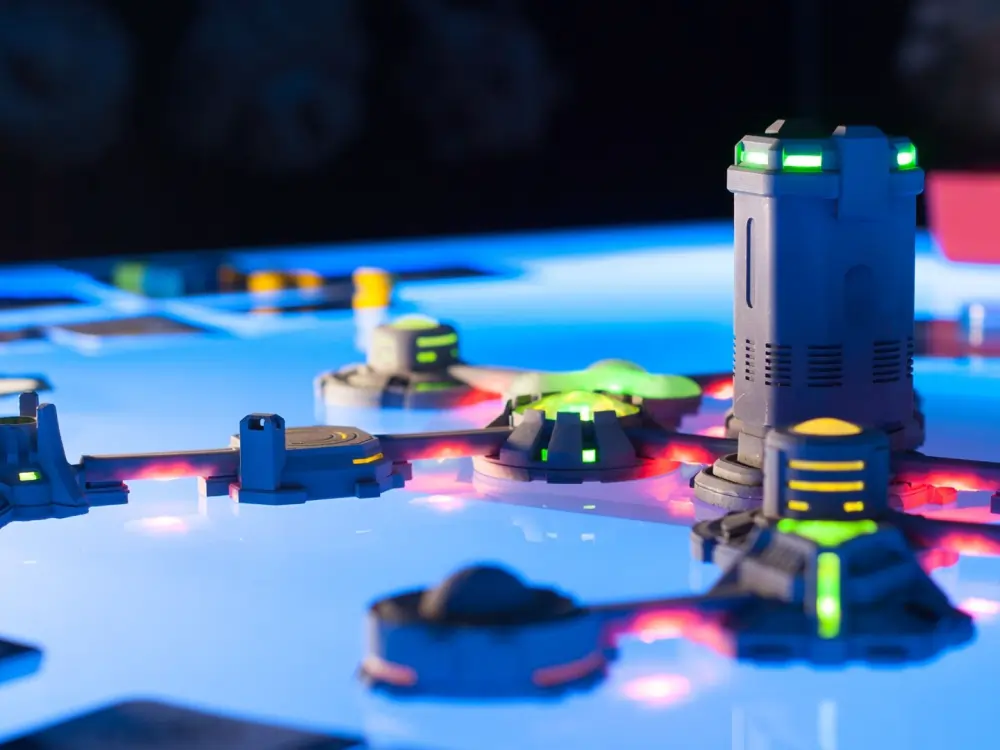 Beyond Humanity Colonies futuristic board game with LED-lit miniature buildings and smart tech