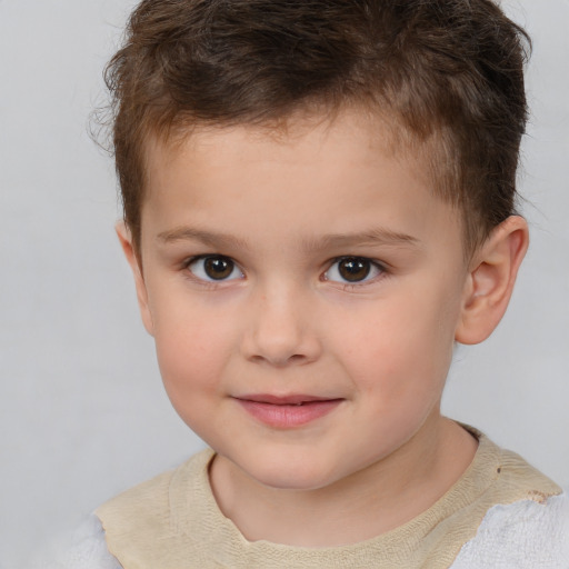 Joyful white child male with short  brown hair and brown eyes