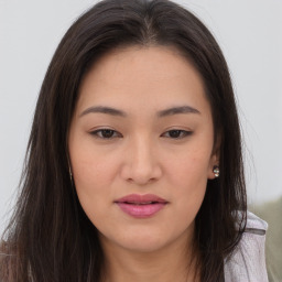 Joyful asian young-adult female with long  brown hair and brown eyes