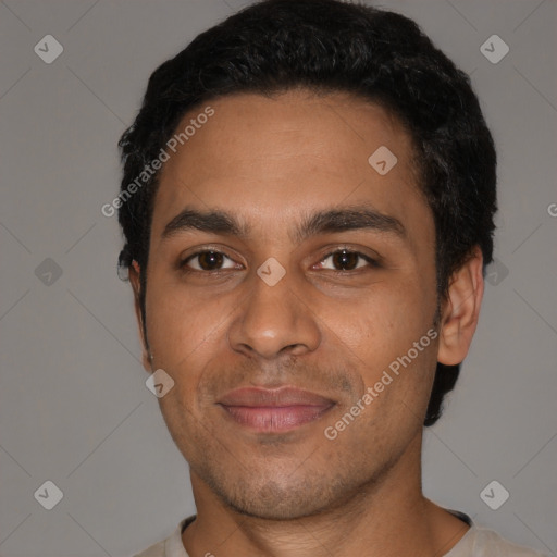 Joyful latino young-adult male with short  black hair and brown eyes