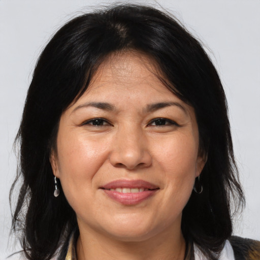 Joyful white adult female with medium  brown hair and brown eyes