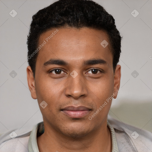 Joyful black young-adult male with short  brown hair and brown eyes