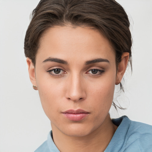 Neutral white young-adult female with short  brown hair and brown eyes