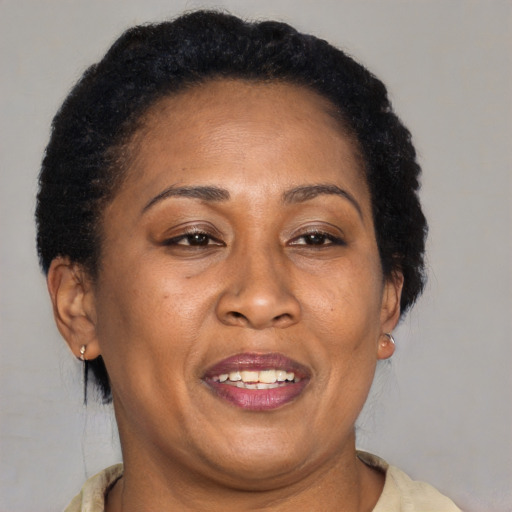 Joyful latino adult female with short  brown hair and brown eyes