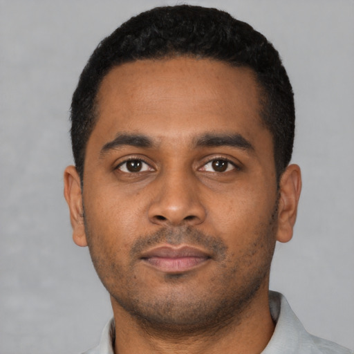 Neutral black young-adult male with short  black hair and brown eyes