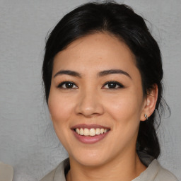 Joyful asian young-adult female with medium  black hair and brown eyes