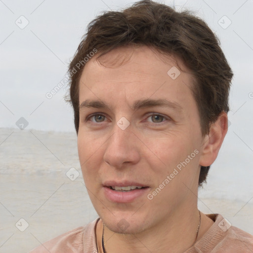 Joyful white adult male with short  brown hair and brown eyes