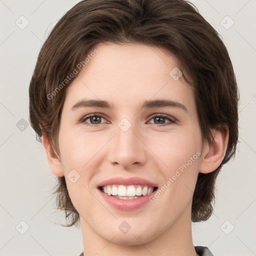 Joyful white young-adult female with medium  brown hair and green eyes