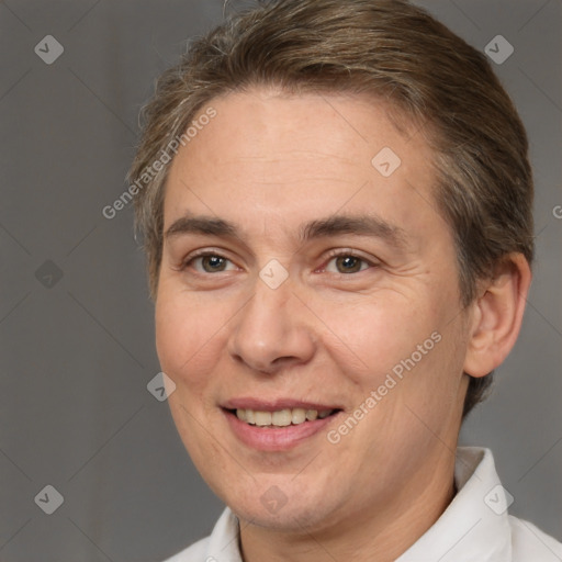 Joyful white adult female with short  brown hair and brown eyes