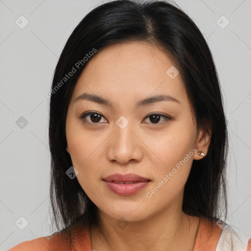 Joyful asian young-adult female with medium  black hair and brown eyes