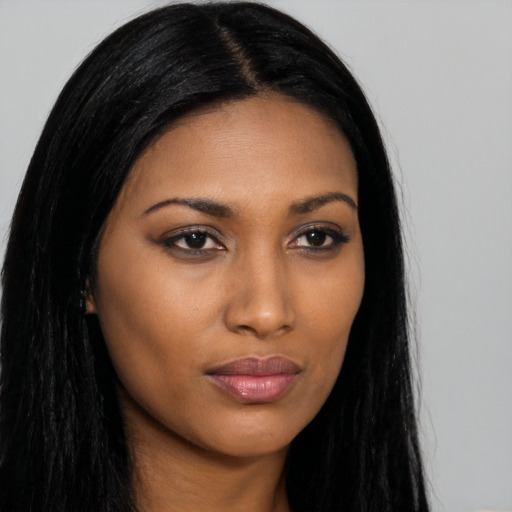 Joyful asian young-adult female with long  black hair and brown eyes