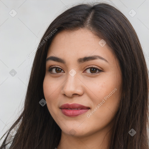 Joyful latino young-adult female with long  brown hair and brown eyes