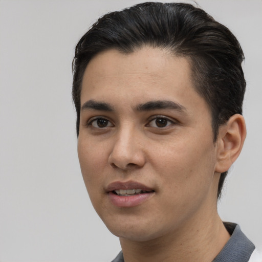 Joyful white young-adult male with short  black hair and brown eyes