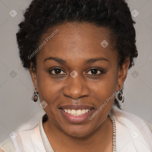 Joyful black young-adult female with short  brown hair and brown eyes