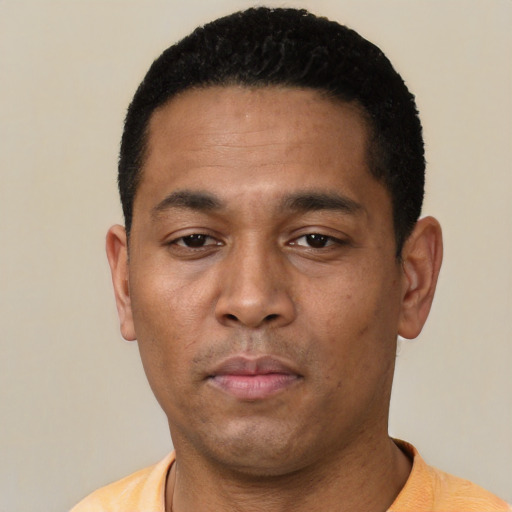 Neutral latino young-adult male with short  black hair and brown eyes