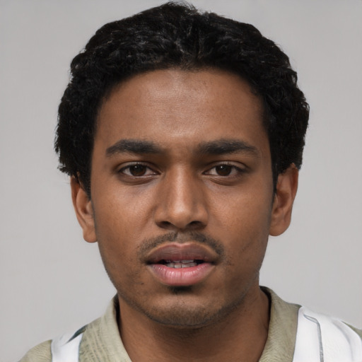 Neutral black young-adult male with short  black hair and brown eyes