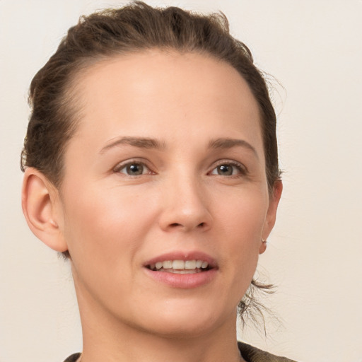 Joyful white young-adult female with medium  brown hair and brown eyes