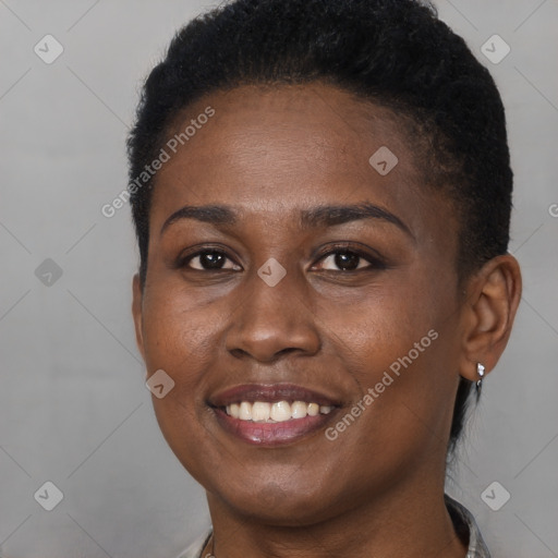 Joyful black young-adult female with short  brown hair and brown eyes