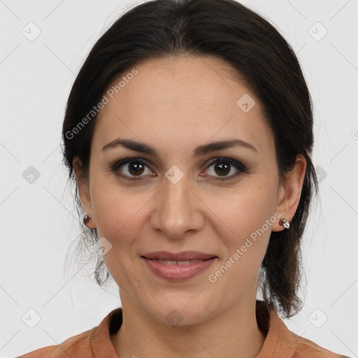 Joyful white adult female with medium  brown hair and brown eyes