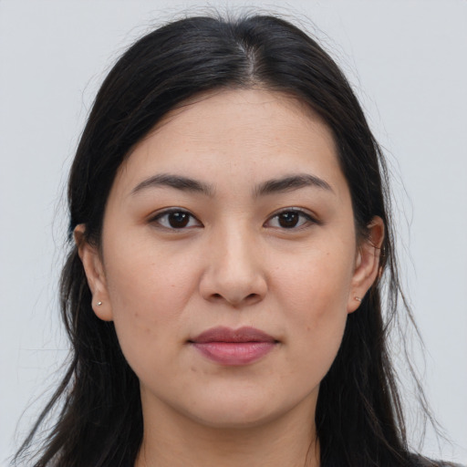 Joyful white young-adult female with long  brown hair and brown eyes
