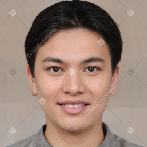 Joyful asian young-adult male with short  black hair and brown eyes