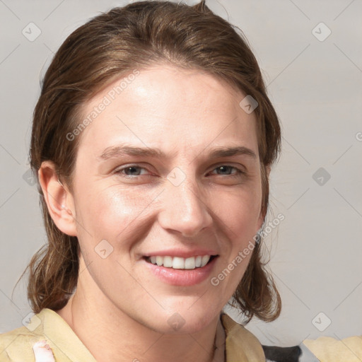 Joyful white young-adult female with medium  brown hair and grey eyes