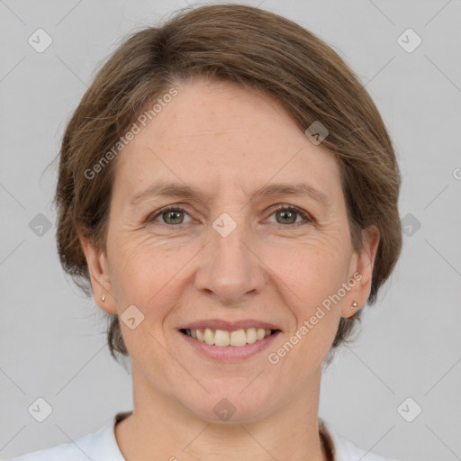 Joyful white adult female with medium  brown hair and brown eyes