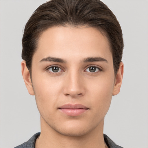 Neutral white young-adult male with short  brown hair and brown eyes