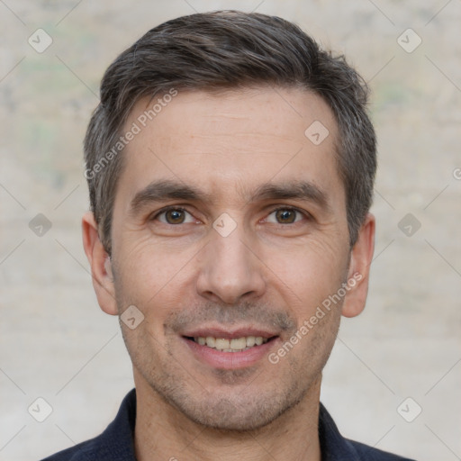 Joyful white adult male with short  brown hair and brown eyes