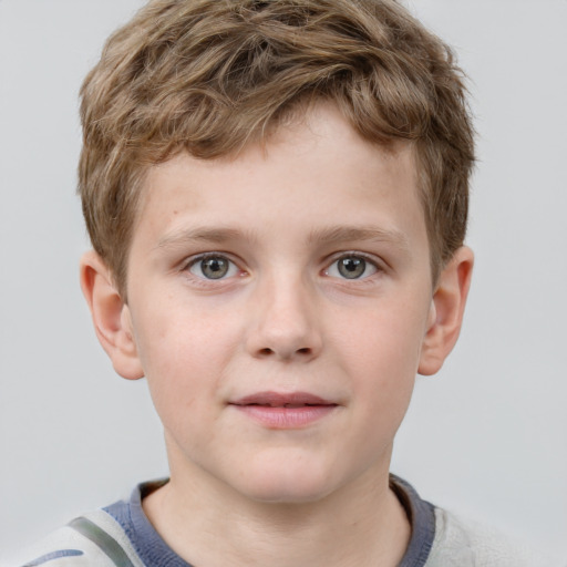 Joyful white child male with short  brown hair and grey eyes