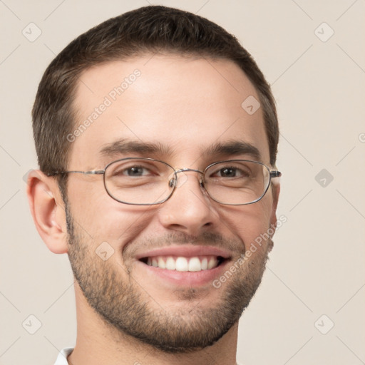 Joyful white young-adult male with short  brown hair and grey eyes