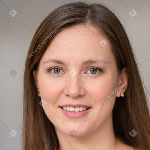 Joyful white young-adult female with long  brown hair and green eyes