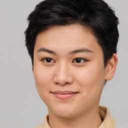 Joyful asian young-adult female with short  brown hair and brown eyes