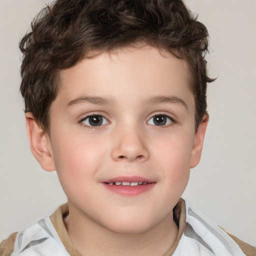 Joyful white child male with short  brown hair and brown eyes