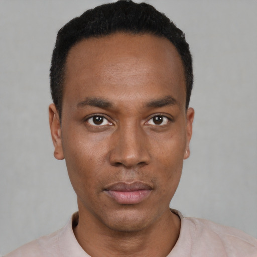 Neutral black young-adult male with short  black hair and brown eyes