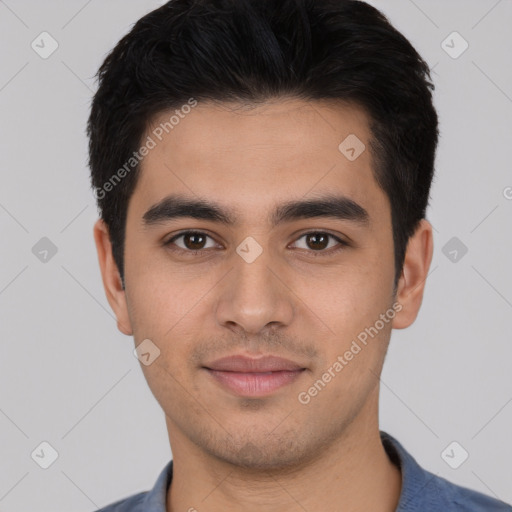 Joyful white young-adult male with short  black hair and brown eyes