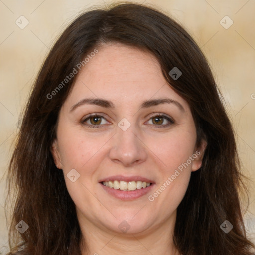 Joyful white adult female with long  brown hair and brown eyes