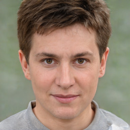 Joyful white adult male with short  brown hair and grey eyes