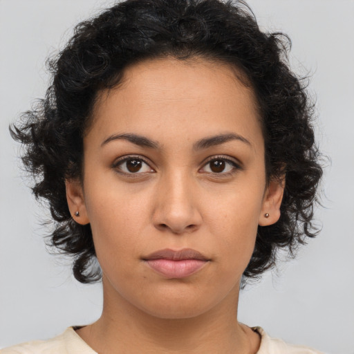Neutral latino young-adult female with medium  brown hair and brown eyes