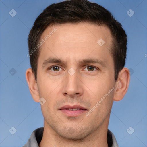 Joyful white adult male with short  brown hair and grey eyes