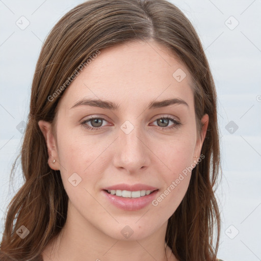 Joyful white young-adult female with long  brown hair and blue eyes