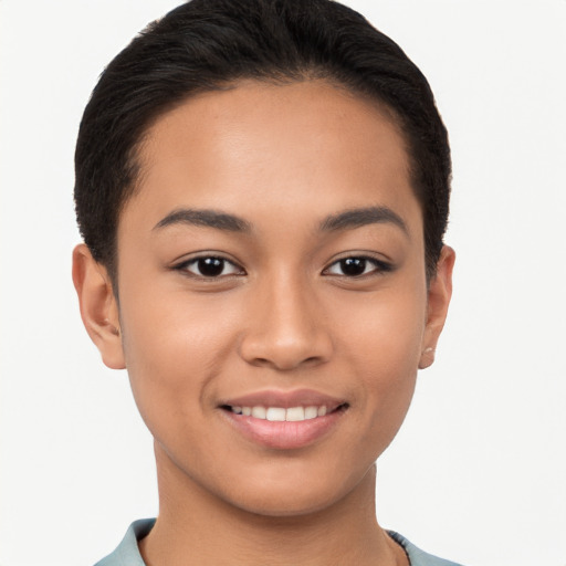 Joyful latino young-adult female with short  brown hair and brown eyes