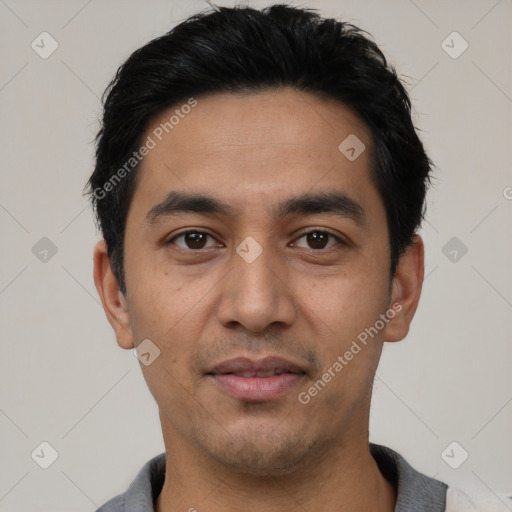 Joyful asian young-adult male with short  black hair and brown eyes