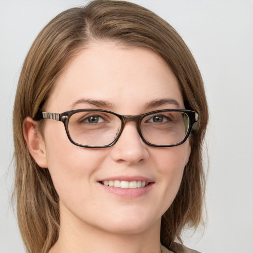 Joyful white young-adult female with medium  brown hair and green eyes