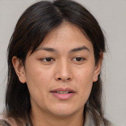 Joyful white adult female with medium  brown hair and brown eyes